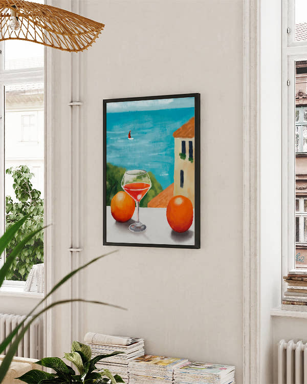 Aussicht auf Meer von Balkon aus, Glas Wein und Orangen daneben